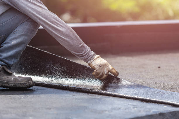 Professional Basement Waterproofing technician working in Ora, IN